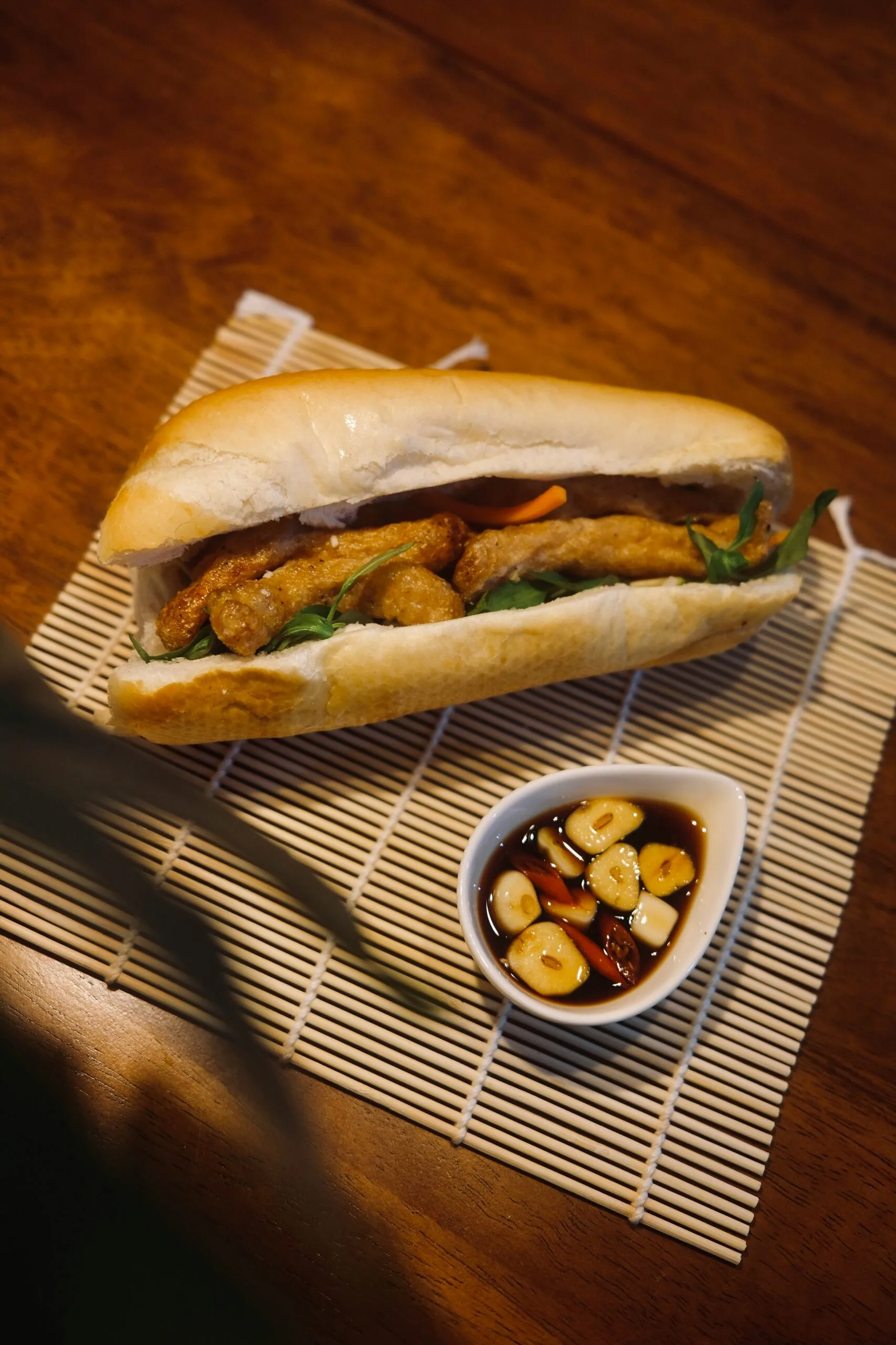 Exploring Goa a sandwich and a bowl of food on a table
